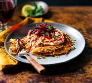 Parsnip rösti with harissa, feta & caramelised red onions