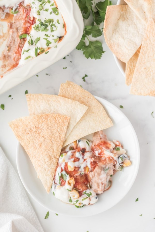 Party bean dip with baked tortilla chips