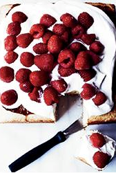 Party cake with whipped cream and raspberries