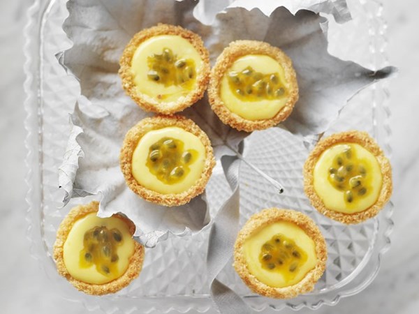 Passionfruit curd tarts with raspberries & coconut