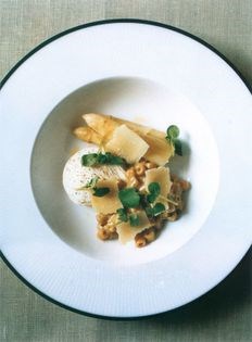 Pasta in mushroom sauce with poached egg and white asparagus
