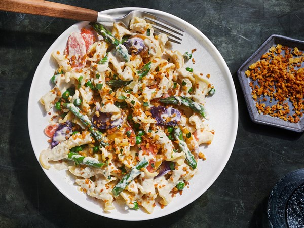 Pasta primavera with creamy pine nut sauce