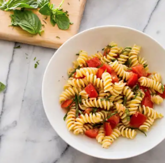 Pasta salad with fresh tomatoes and basil