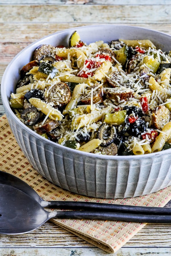 Pasta salad with sausage, zucchini, olives, and peppers