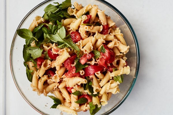 Pasta salad with summer tomatoes, basil and olive oil