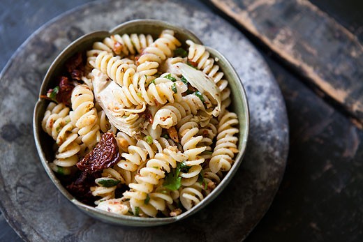Pasta with artichoke hearts, sun dried tomatoes, and toasted almonds