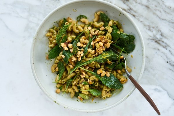 Pasta with baby kale, toasted pumpkin seeds, and pesto