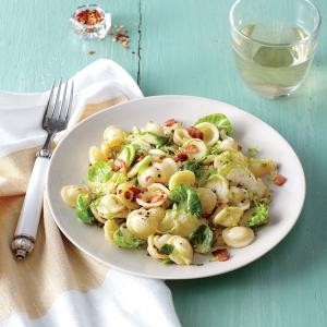 Pasta with bacon, shredded Brussels sprouts, and lemon zest