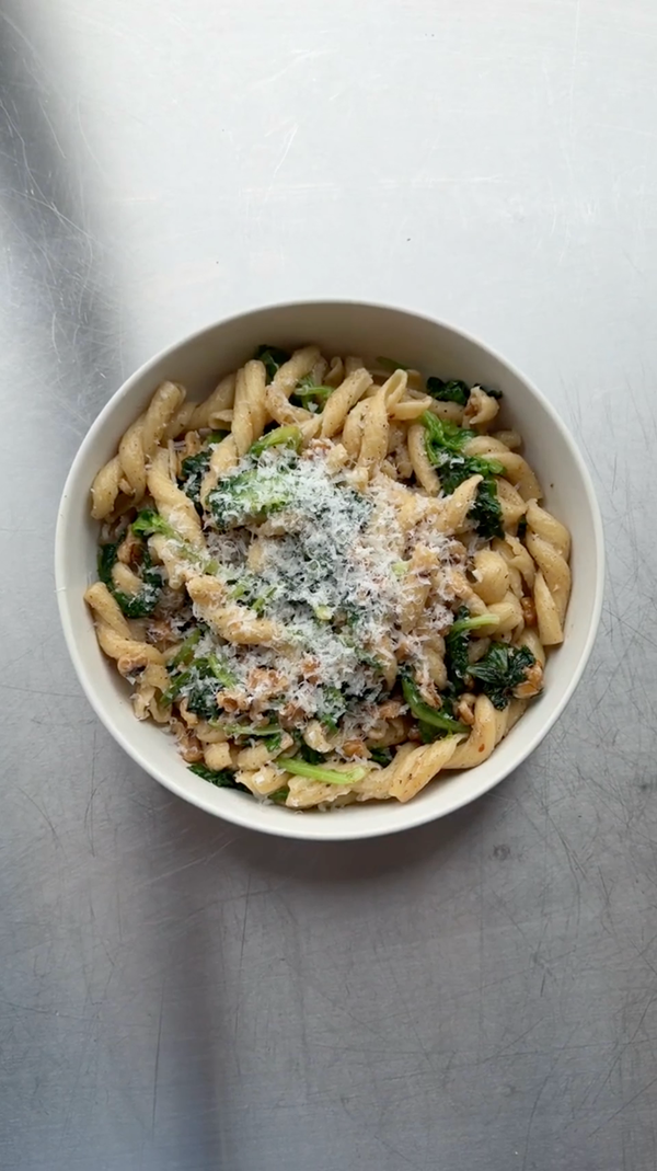Pasta with brown butter wilted greens and walnuts