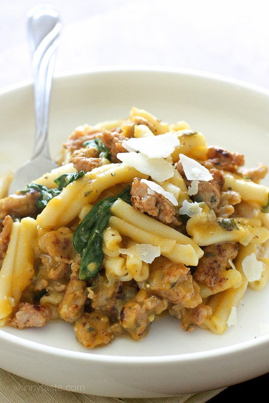 Pasta with butternut squash sauce, spicy sausage and baby spinach