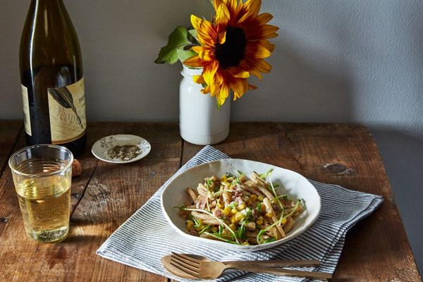 Pasta with corn, pea tendrils, prosciutto, and summer savory