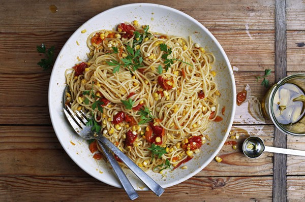 Pasta with corn, slow-cooked tomatoes, and garlic confit