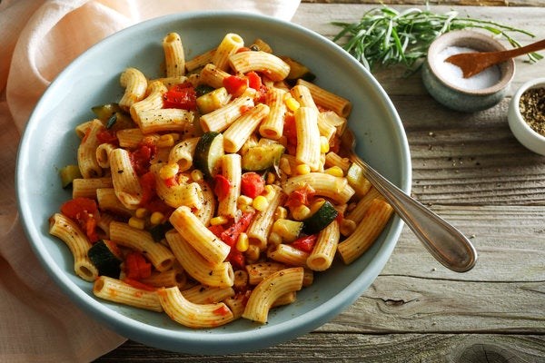 Pasta with corn, zucchini, and tomatoes