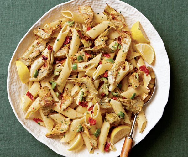 Pasta with garlicky roasted artichoke hearts, sun-dried tomatoes, and olives