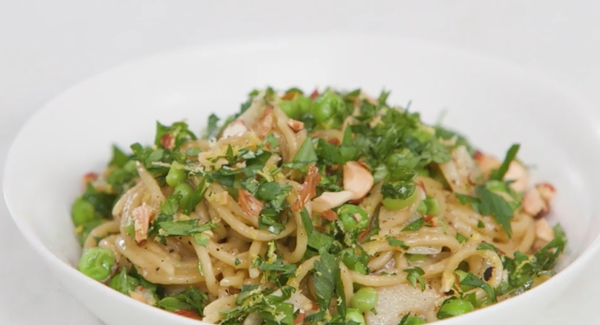 Pasta with green peas and almond gremolata