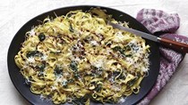 Pasta with kale, currants, pine nuts, and garlic butter