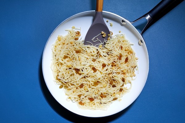 Pasta with pine nuts and golden raisins