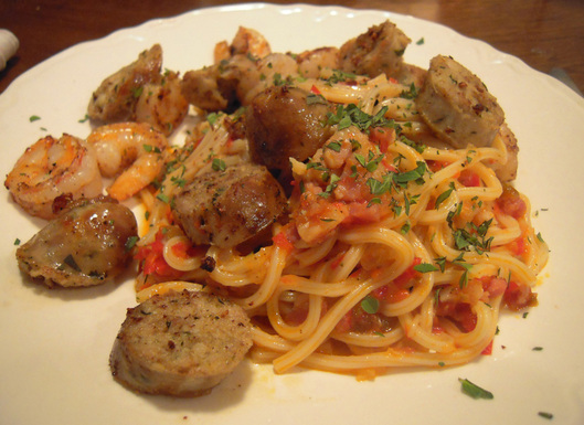 Pasta with red pepper sauce, sausage, and shrimp
