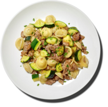 Pasta with sausage and sautéed zucchini