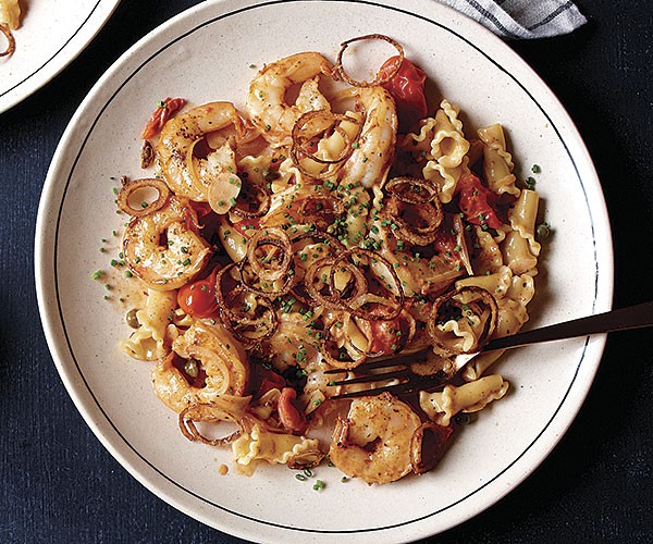 Pasta with shrimp, shallots, and cherry tomatoes in Madeira sauce