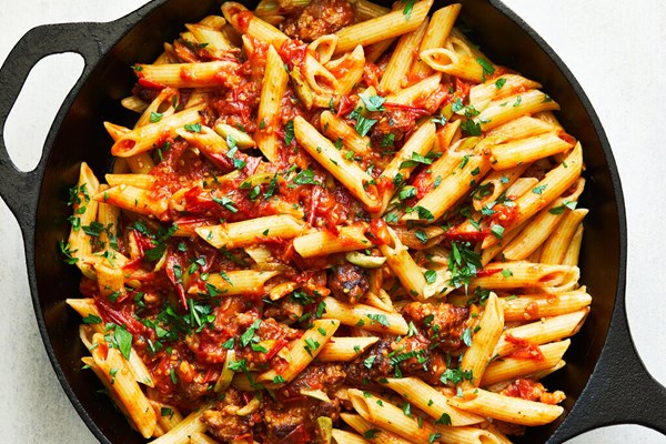 Pasta with spicy sausages, tomatoes, rosemary and olives