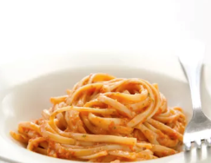 Pasta with tomato and almond pesto
