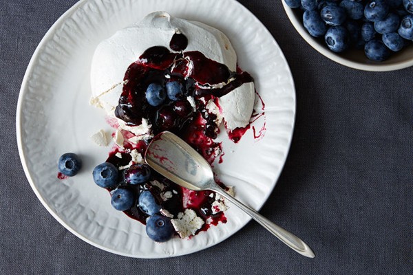 Pavlova with boozy blueberry sauce