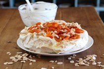 Pavlova with dried apricots in verjuice syrup