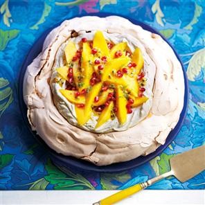 Pavlova with lime cream and tropical fruits