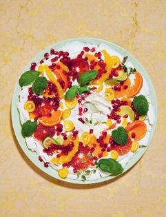 Pavlova wreath with lime cream & seasonal fruits