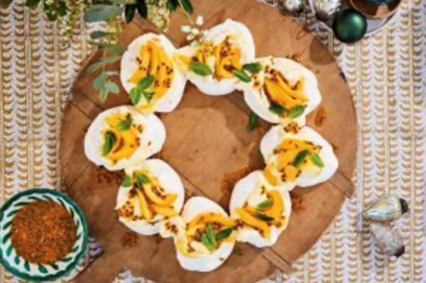 Pavlova wreath with mango cream and passionfruit mint syrup