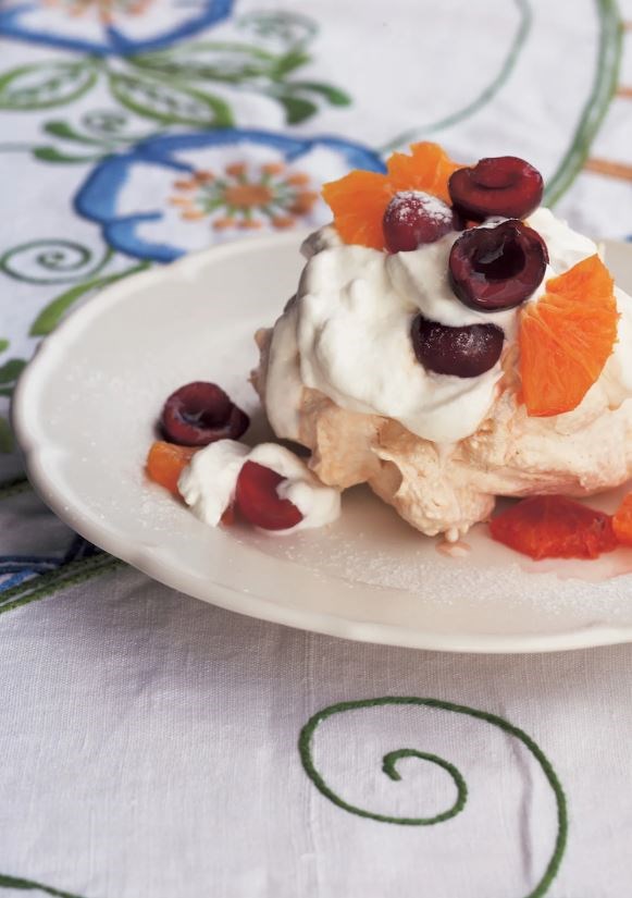 Pavlovas with oranges and cherries
