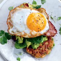 Pea fritters with bacon, spinach and fried duck eggs