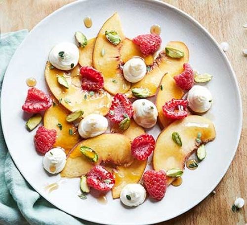 Peach & raspberry fruit salad with mascarpone