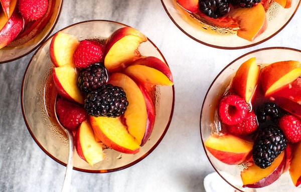 Peach and berry macedonia with sparkling rosé