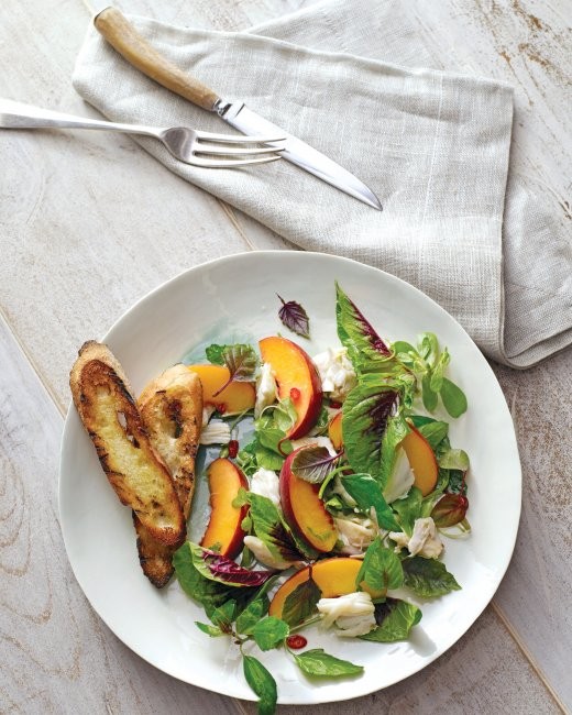 Peach and crab salad with mesclun and herbs