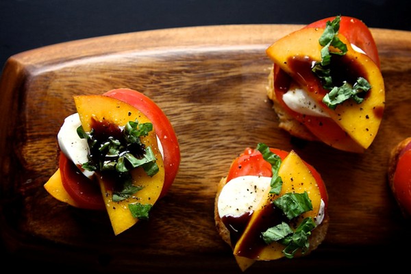 Peach tomato and mozzarella crostini