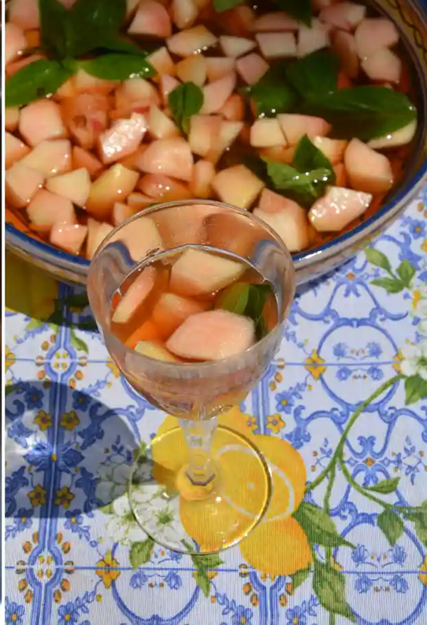 Peaches and basil in wine