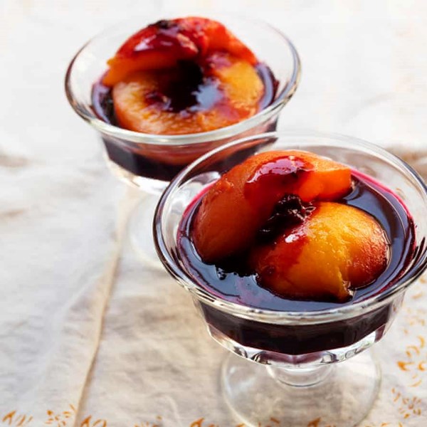 Peaches with blackcurrant sauce