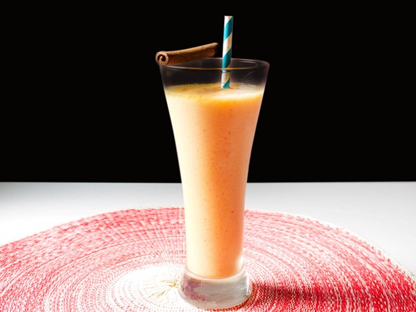 Peachy rum and coconut frozen blended cocktail