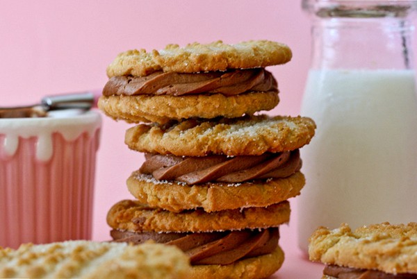 Peanut butter cookie sandwiches with brownie batter frosting