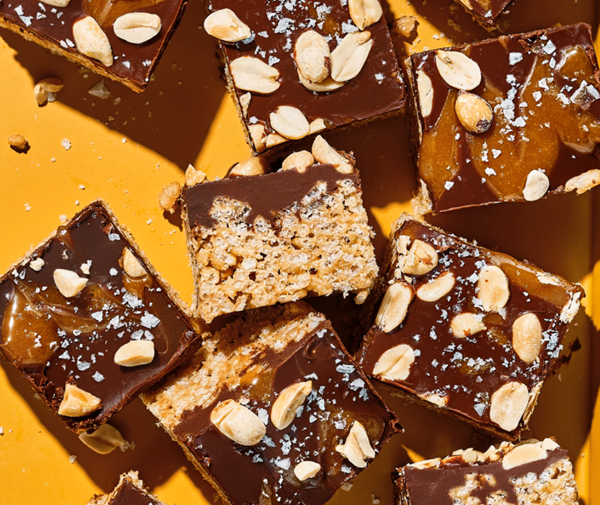 Peanut butter crispy rice treats with chocolate & caramel drizzle