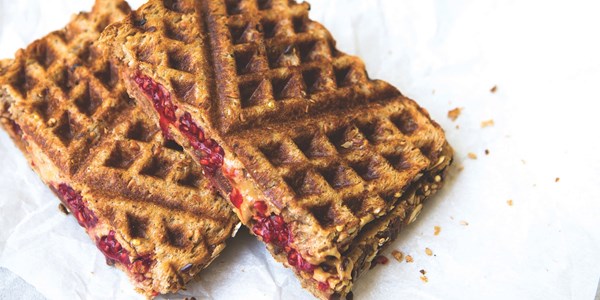 Peanut butter raspberry waffle iron sandwich