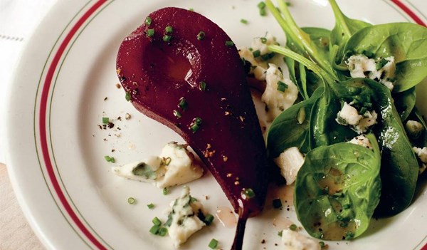 Pears poached in red wine with Roquefort and spinach salad