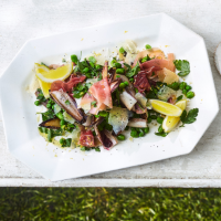 Peas and broad beans with charred chicory and prosciutto