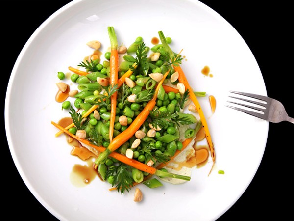 Peas and carrots salad with goat cheese and almonds