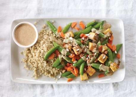 Peas, carrots, and tempeh with miso-almond sauce