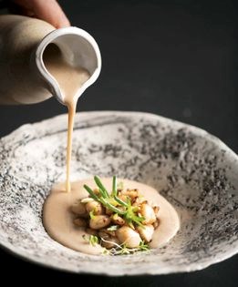 Peasant flour soup with frog legs and scallions