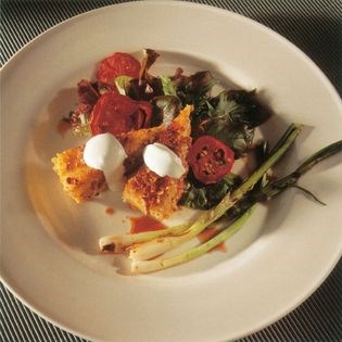 Pecan-polenta salad with grilled green onions and crème fraiche