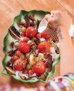 Peeled tomatoes with burnt toast & torn herbs in cold cream